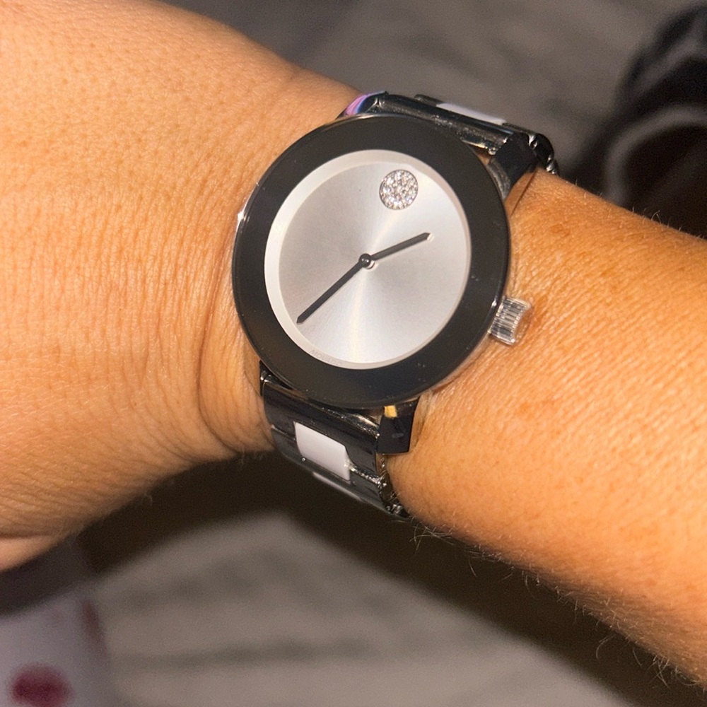 Silver and white Movado watch